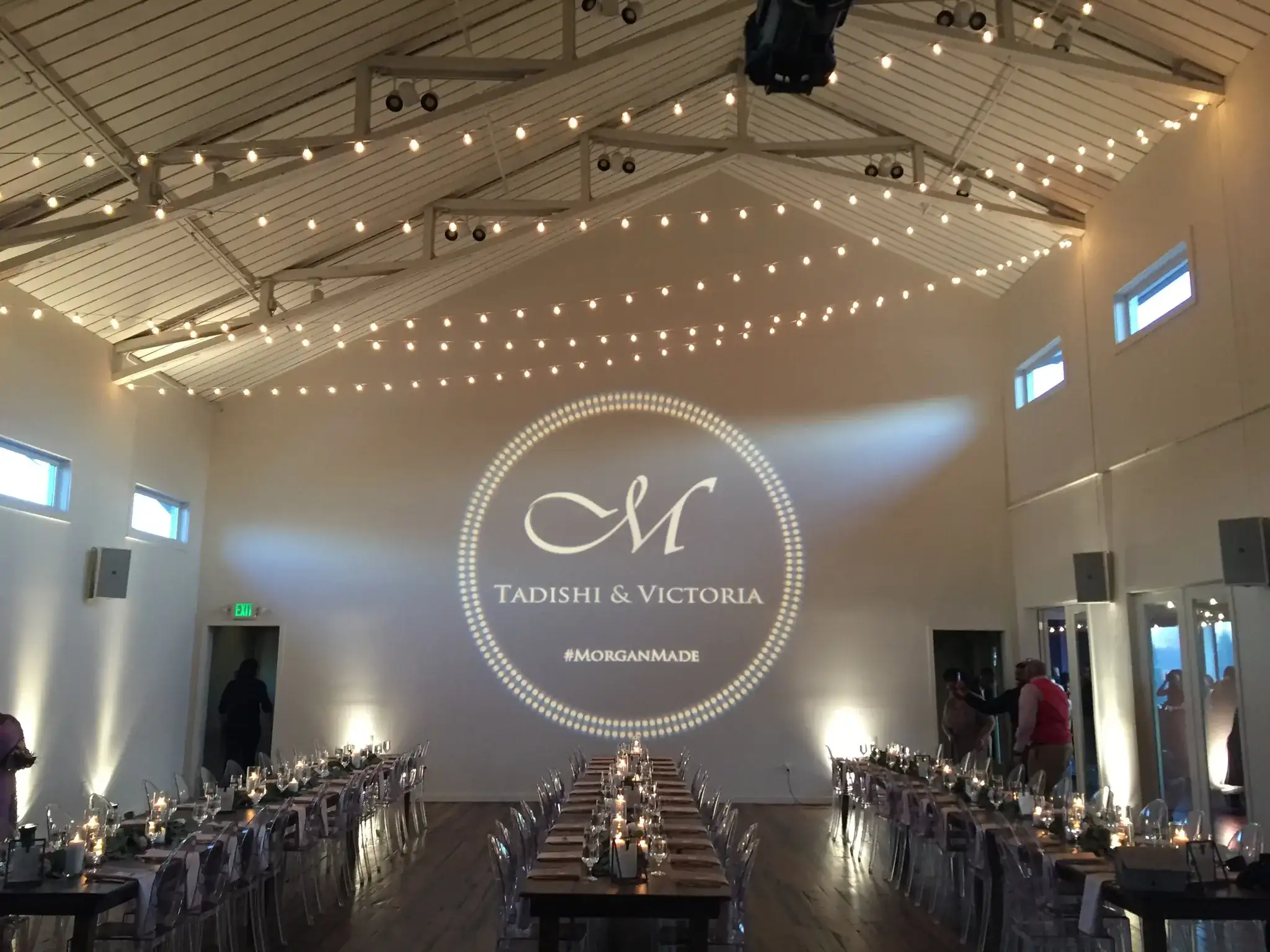 Custom monogram gobo projected at a wedding